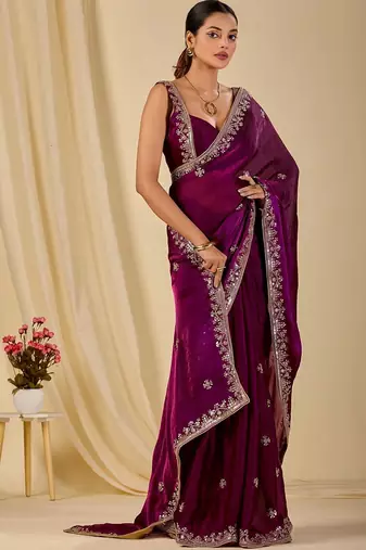 Purple ethnic motifs embroidered organza saree