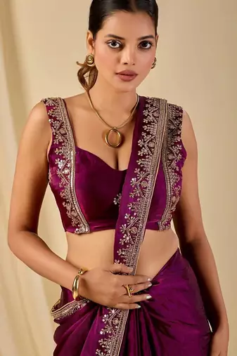 Purple ethnic motifs embroidered organza saree