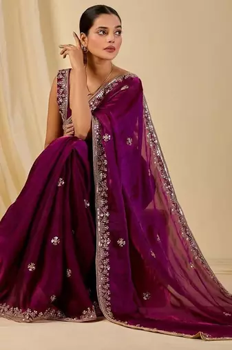 Purple ethnic motifs embroidered organza saree