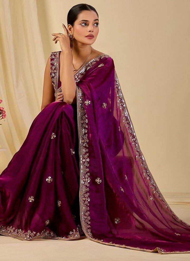 Purple ethnic motifs embroidered organza saree