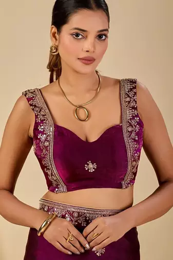 Purple ethnic motifs embroidered organza saree