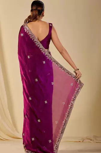 Purple ethnic motifs embroidered organza saree