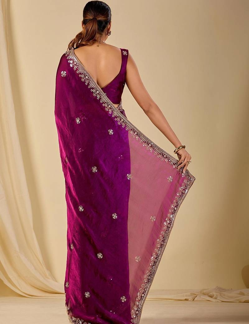Purple ethnic motifs embroidered organza saree
