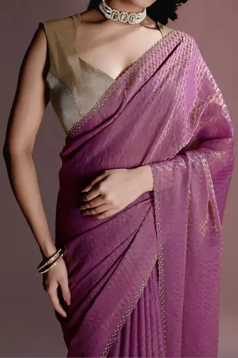 Purple women ethnic motifs woven design saree