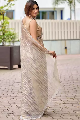 Beige floral beads and stones tissue saree