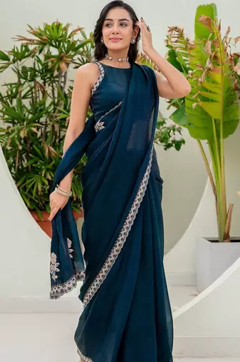 Teal embroidered silk blend saree
