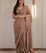 Gold sequinned satin saree