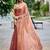 Peach ethnic motifs embroidered organza saree