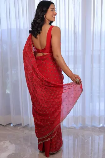 Red sequinned silk cotton saree