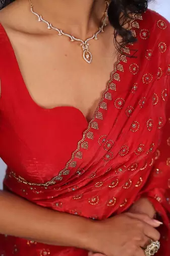 Red sequinned silk cotton saree