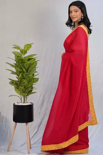 Red sequinned satin saree