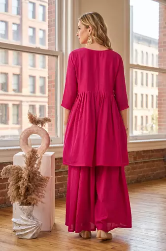 Coral rani pink embroidered yoke pleated short kurti with flared palazzo set for women