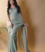 Sea green georgette silk saree with blouse piece