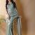 Sea green georgette silk saree with blouse piece