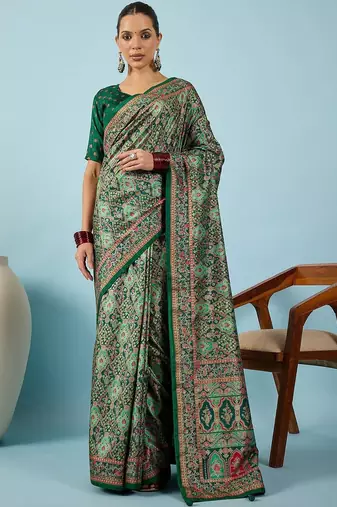 Green ethnic motifs embroidered silk blend banarasi saree