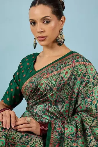 Green ethnic motifs embroidered silk blend banarasi saree