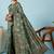 Green ethnic motifs embroidered silk blend banarasi saree