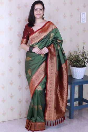 Green ethnic motifs zari silk blend banarasi saree