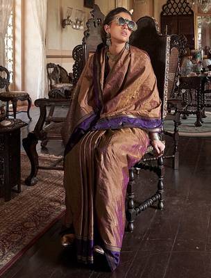 Beige ethnic motifs woven design zari tussar saree 2