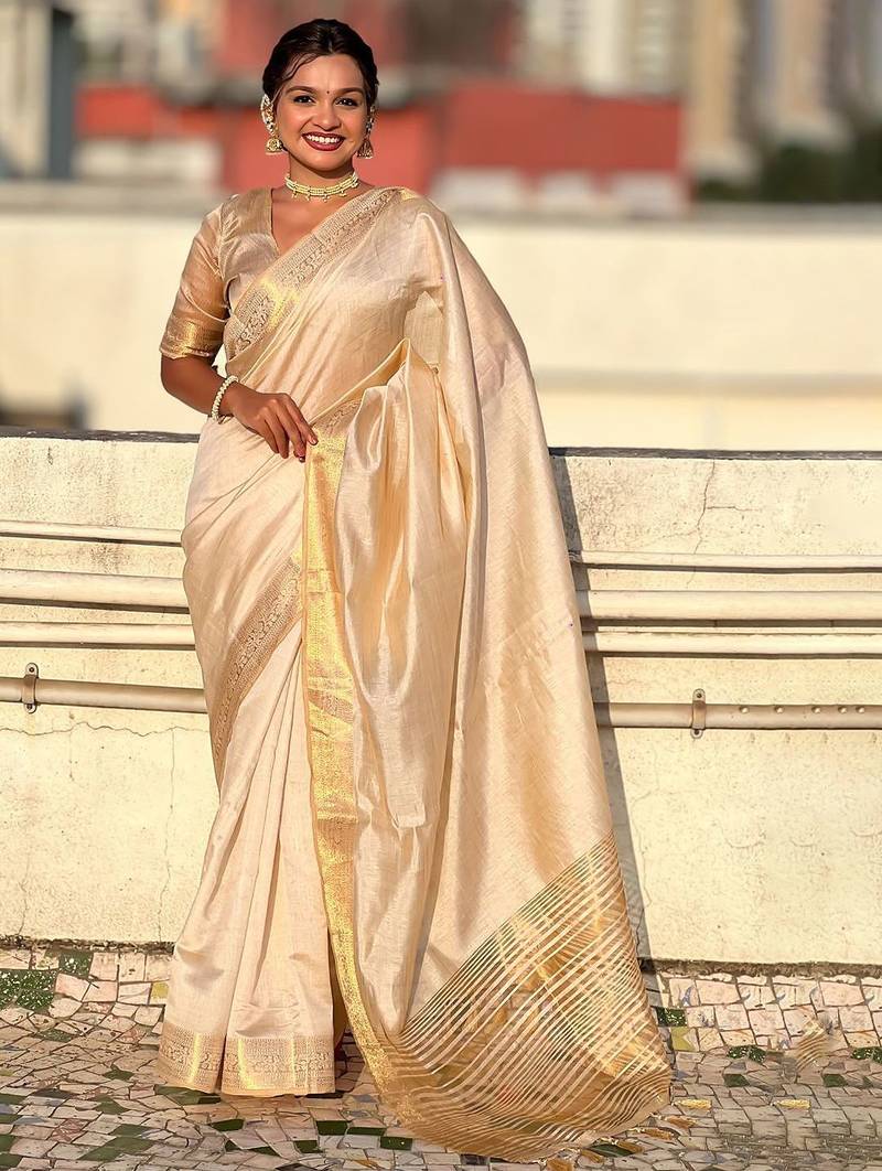 Cream woven design tissue tussar saree