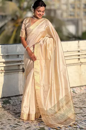Cream woven design tissue tussar saree