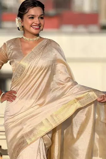 Cream woven design tissue tussar saree