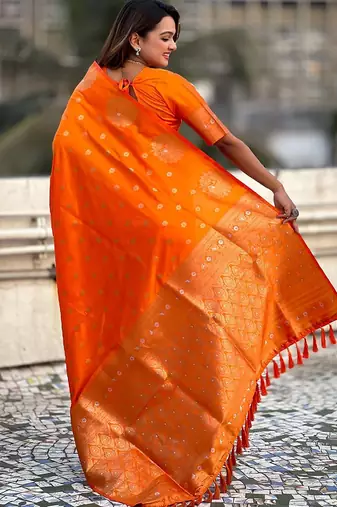Orange ethnic motifs woven design zari banarasi saree