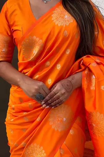 Orange ethnic motifs woven design zari banarasi saree