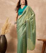 Green solid green embellished beads and stones border satin saree