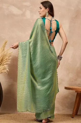 Green solid green embellished beads and stones border satin saree