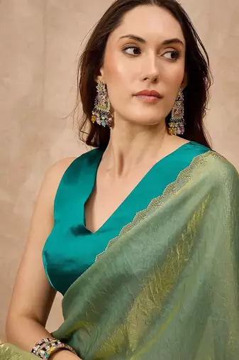 Green solid green embellished beads and stones border satin saree