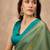 Green solid green embellished beads and stones border satin saree