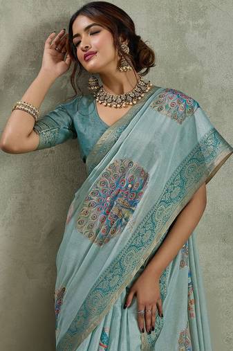 Sea green ethnic motifs sequinned tissue saree