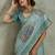 Sea green ethnic motifs sequinned tissue saree