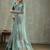 Sea green ethnic motifs sequinned tissue saree