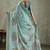 Sea green ethnic motifs sequinned tissue saree