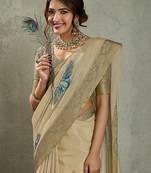 Beige ethnic motifs woven design zari tissue saree