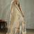 Beige ethnic motifs woven design zari tissue saree