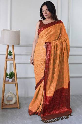 Peach woven design zari  georgette banarasi saree