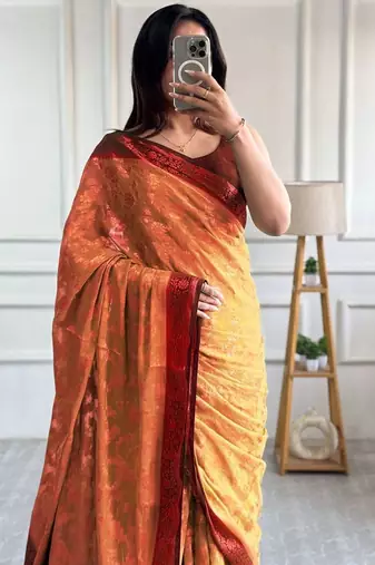 Peach woven design zari  georgette banarasi saree