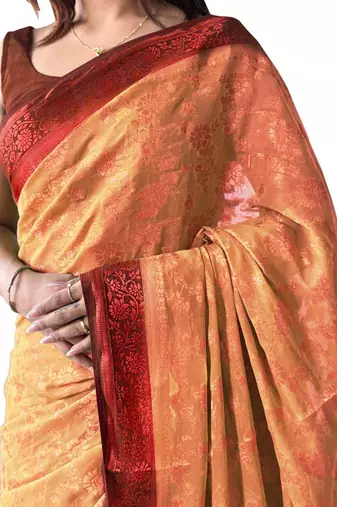 Peach woven design zari  georgette banarasi saree