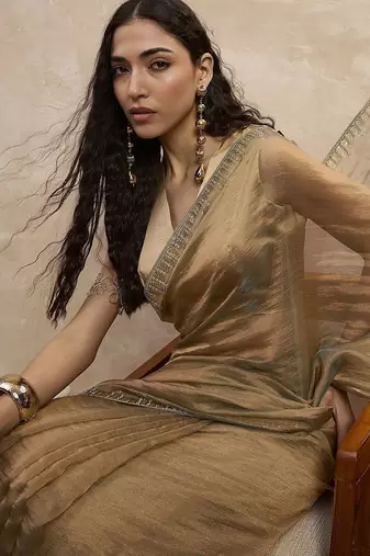 Beige solid beads and stones embellished organza saree with unstitched blouse
