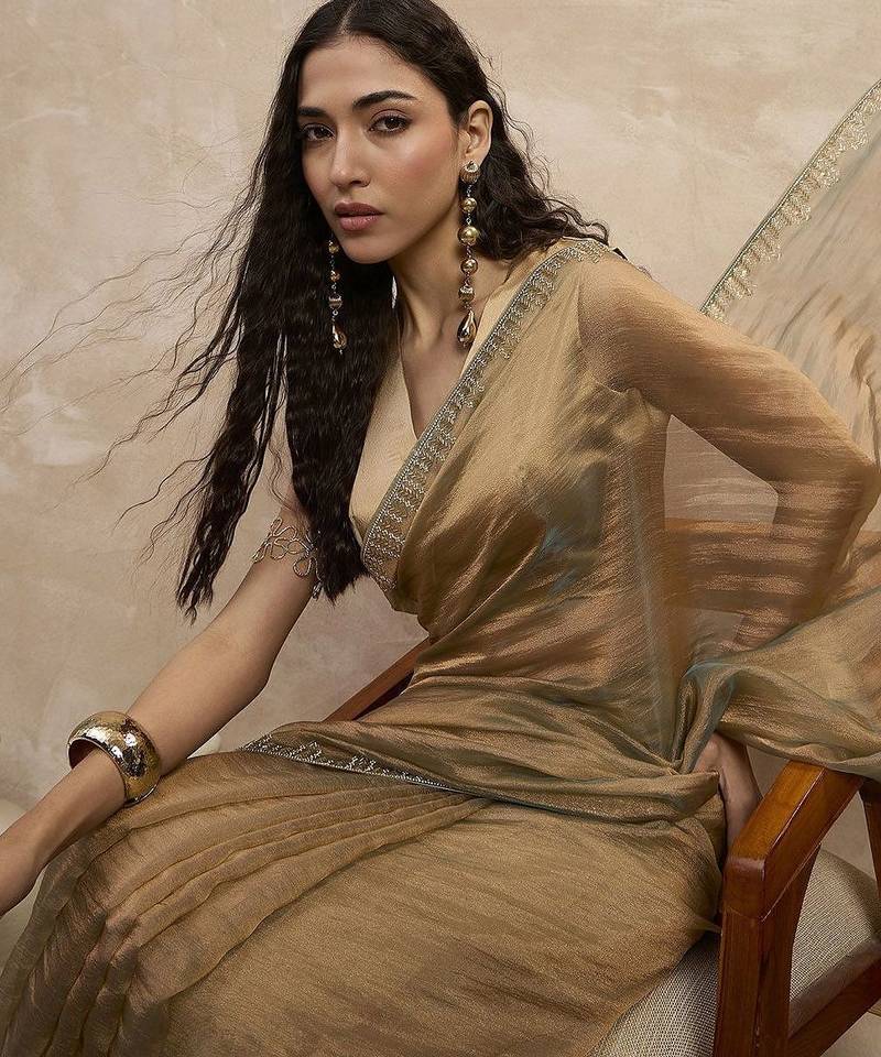 Beige solid beads and stones embellished organza saree with unstitched blouse