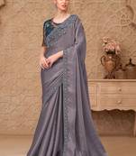 Green woven design sequinned art silk designer saree