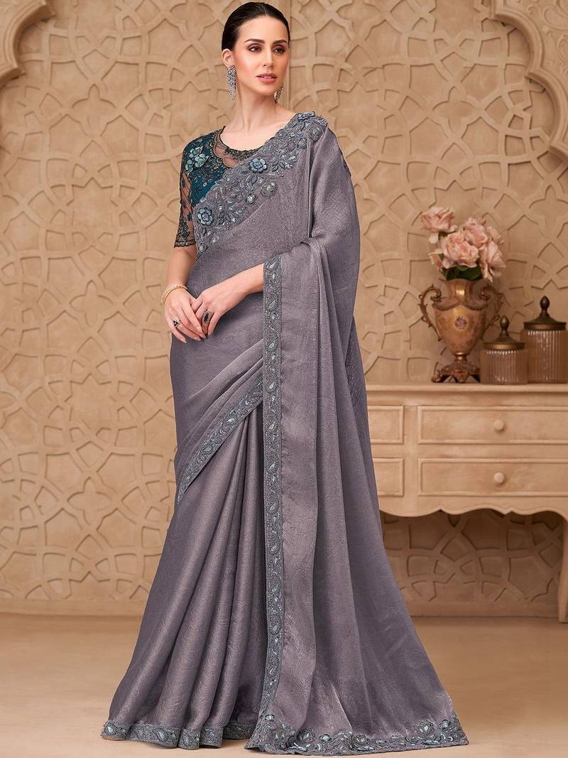 Green woven design sequinned art silk designer saree