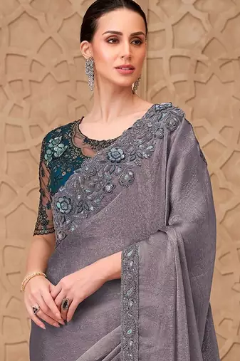 Green woven design sequinned art silk designer saree
