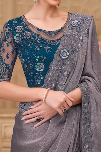 Green woven design sequinned art silk designer saree