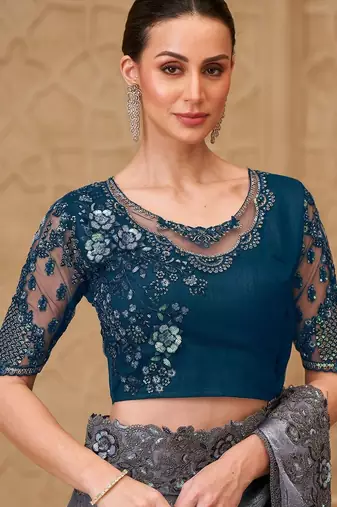 Green woven design sequinned art silk designer saree