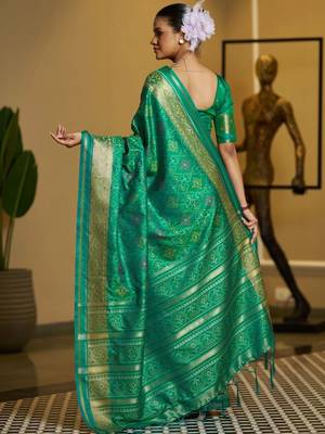 Green woven design zari silk blend designer patola saree 3