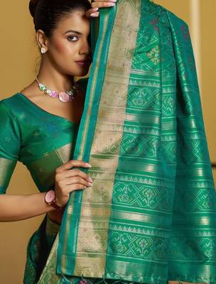 Green woven design zari silk blend designer patola saree 4